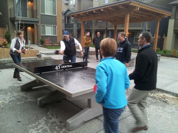 Concrete ping pong table Adults playing on concrete table tennis table multifamily houseing