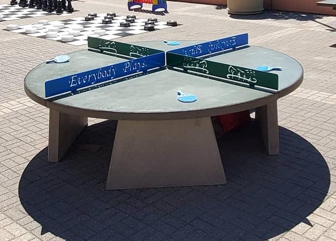 Round four way concrete table tennis table at a resort in Texas Round Four Way Concrete Ping Pong Table at a resort