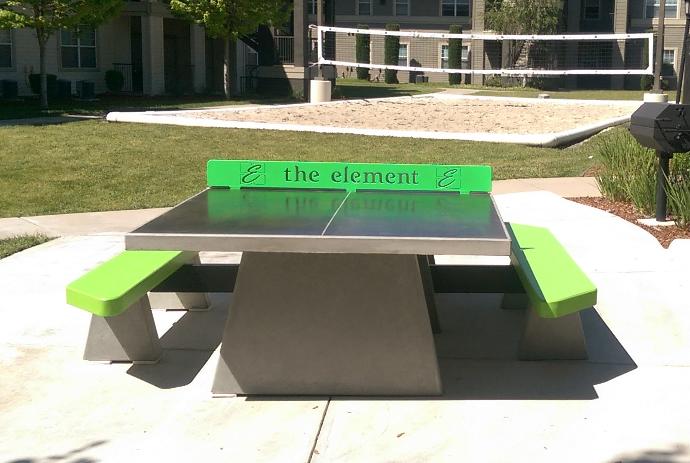 Concrete ping pong table with custom concrete benches at college housing Concrete table tennis table with custom concrete benches at college housing