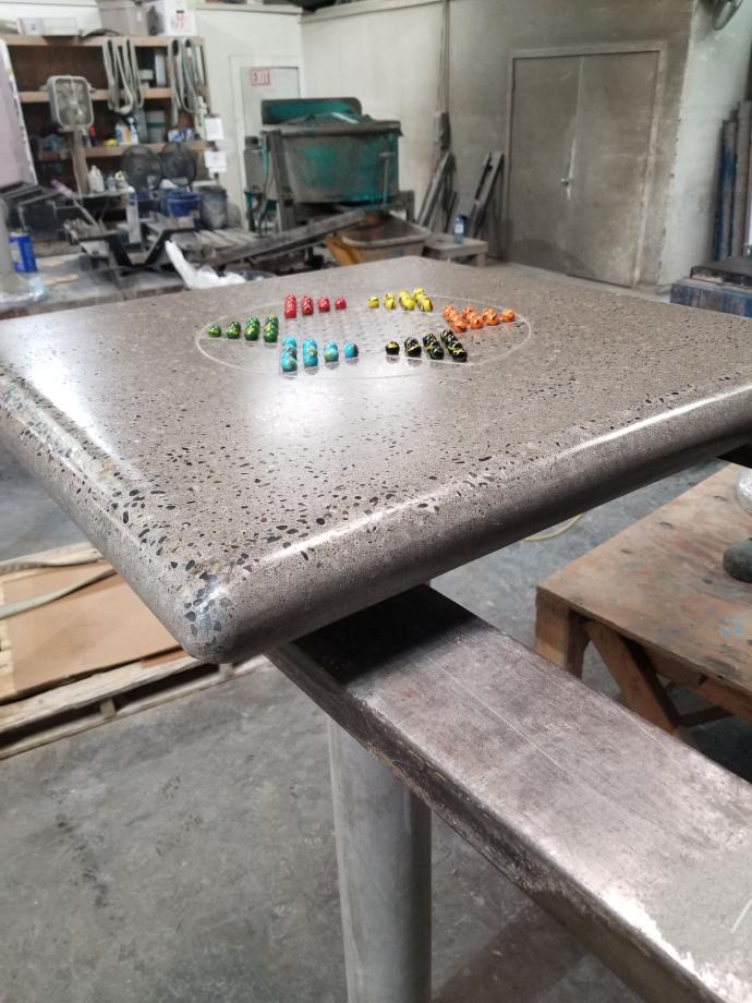 Concrete Chinese Checkers Table – Outdoor Game Table Concrete Chinese Checkers table with polished aggregate finish and marble inlays for outdoor parks.