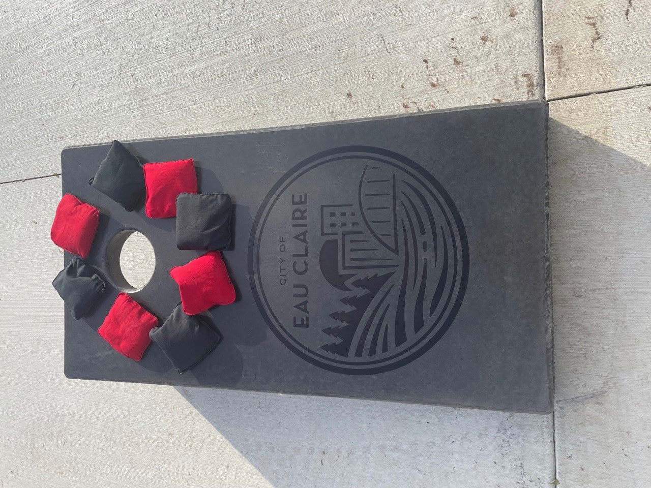 Concrete cornhole board in Eau Claire Wisconsin park