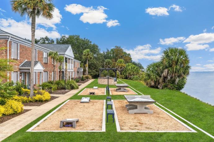 Concrete cornhole boards and concrete ping pong tables at luxury apartments