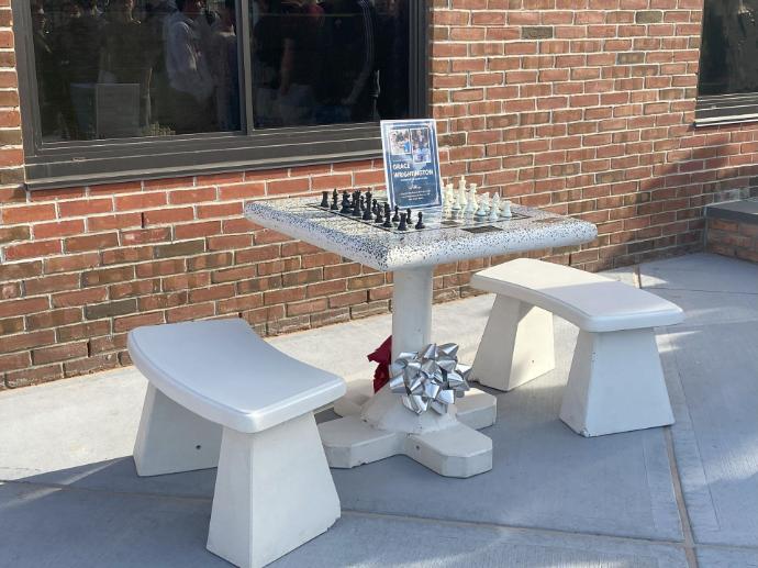 Memorial concrete chess table at school
