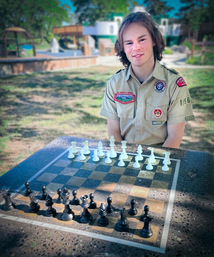Concrete Chess Table with Boy Scout at Campground