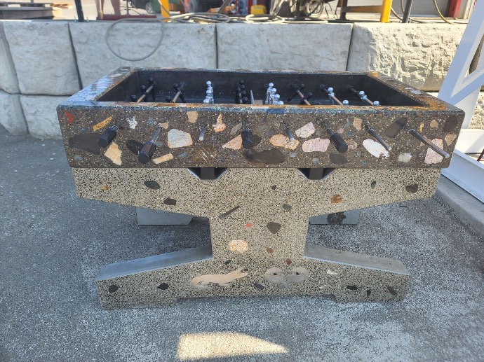 Highly customized concrete foosball tables with inlays of stone, glass and metal
