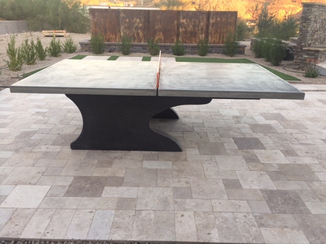 Cantilever concrete ping pong table on a patio in arizona