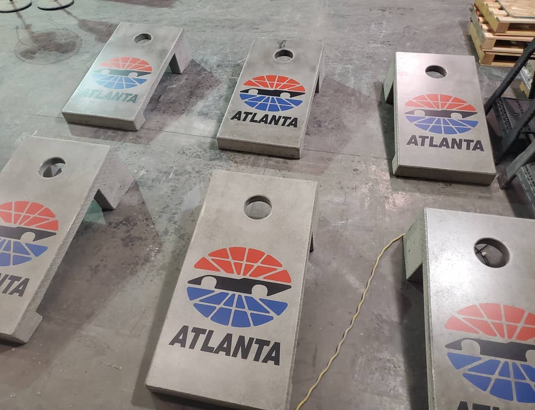 Concrete game table installation at Atlanta Motor Speedway outdoor entertainment venue