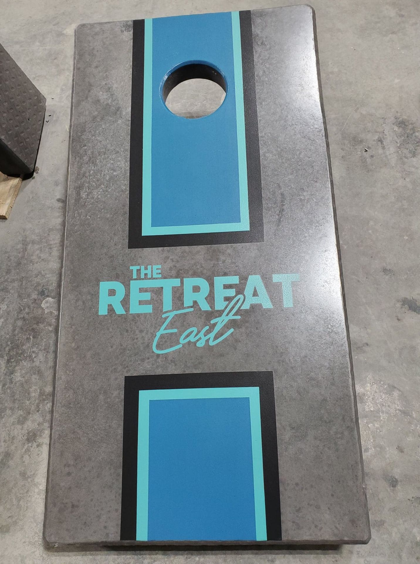 Outdoor concrete game tables at The Retreat Orlando East apartment community