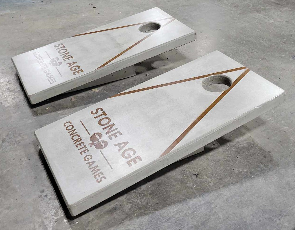 Cantilever design concrete cornhole boards installed at outdoor recreation area
