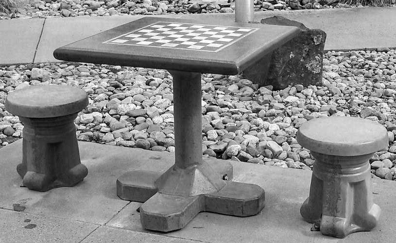 Concrete chess tables with stools installed at outdoor public space