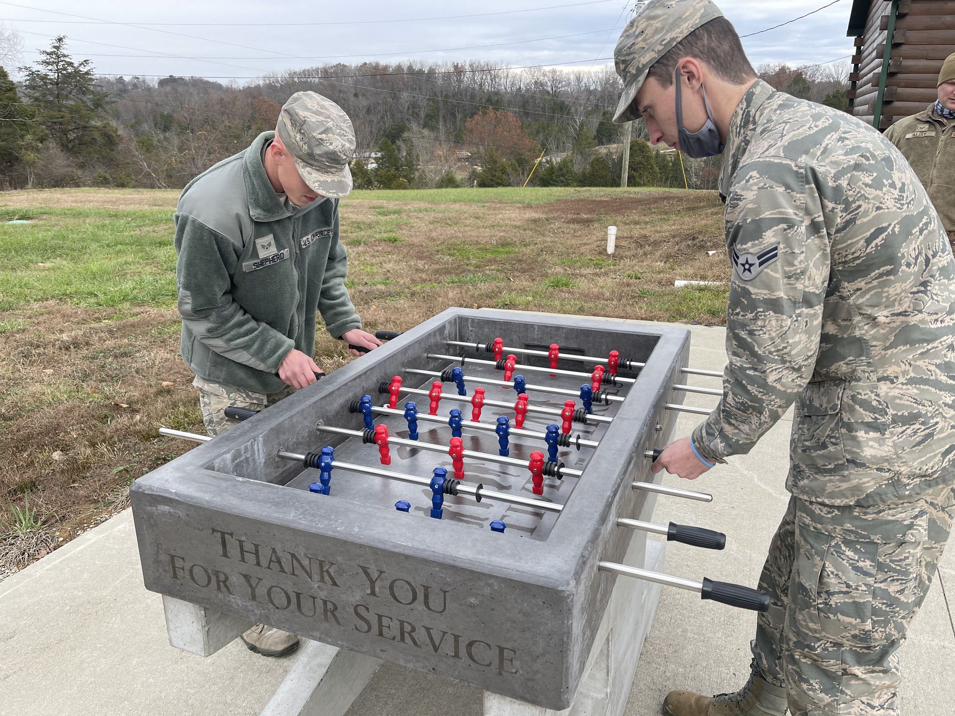 Veterans play! Concrete Foosball at Veterans Camp Veterans playing at concrete foosball table